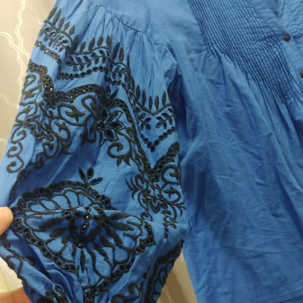very elegant blouse with black embroidery
